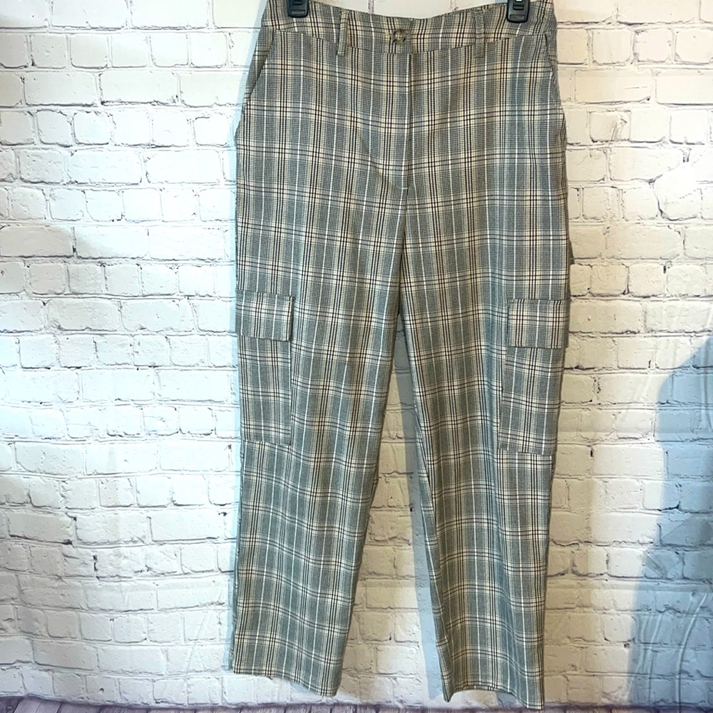 Size 10 tan and black dress slacks. SOFT like new. Side slit pockets andβ¦